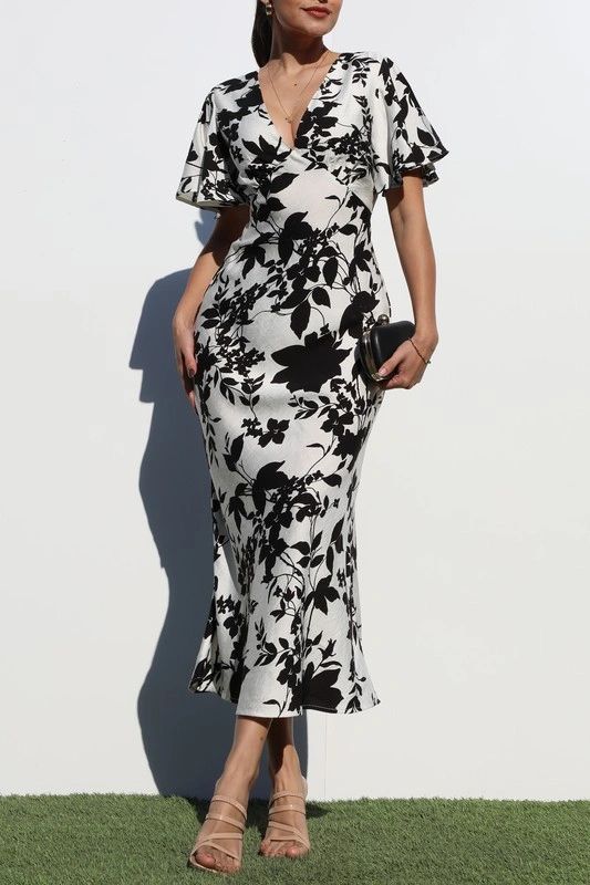 VESTIDO MIDI CON MANGA AMPLIA